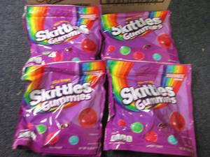 lot 87 image: 4- 12 oz Wild Berry Skittles Gummie...