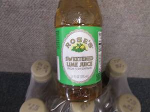 lot 127 image: 6- 12 oz Roses Sweetened Lime Juic...