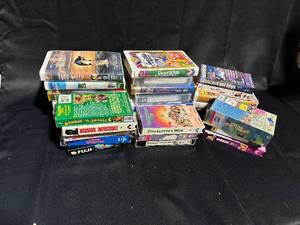 lot 65 image: Group of 15 Vintage VHS Tapes - Family Classics & Popular Movies