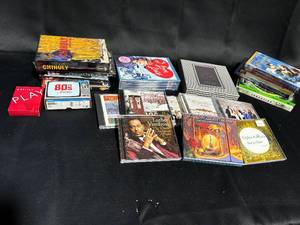 lot 98 image: Assorted Collection of 24 CDs and DVDs - Music and Movies