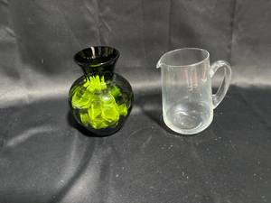 lot 104 image: Set of 2 Decorative Glass Pieces - Green Art Glass Vase & Clear Glass Pitcher