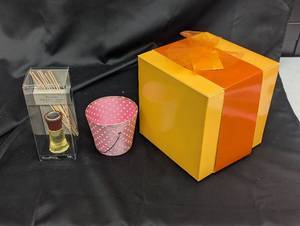 lot 151 image: Gift Boxed Set of 4 Red Glass Martini Glasses and WoodWick Fireside Reed Diffuser
