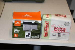 lot 541 image: Lot of (2 Boxes) Portable Toilet Waste Bags - Reliance Double Doodie, Ozark Trail Outdoor Equipment 6-count ( 12 total items )