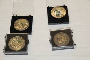 lot 562 image: Lot of (4) Commemorative Coins - Minnesota Wild 2007-08, 2008-09, 2009-10, 2010-11