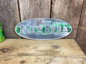 lot 143 image: Vintage New Idea Oval Metal Implement Sign
