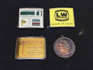 lot 197 image: 3 Vintage Advertiser Tape Measures & A Lighter