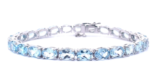 Vivacious 15 Carats Oval Blue Topaz Tennis Bracelet