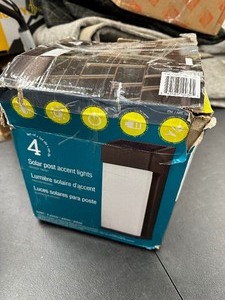 lot 55 image: New Open Box 4 Pack Solar Post Accent Lights  LED Exterior Wall Sconce Lights