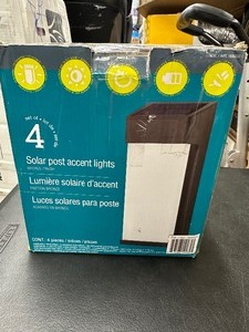 lot 56 image: Like New Open Box 4 Pack Solar Post Accent Lights  LED Exterior Wall Sconce Lights