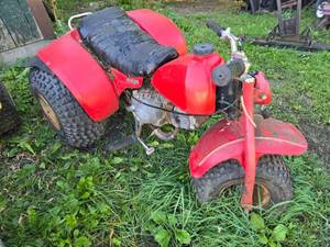 lot 34 image: Red 3 Wheeler ATV - For Parts or Repair Only - Item is Off Site in SVEA See Desc