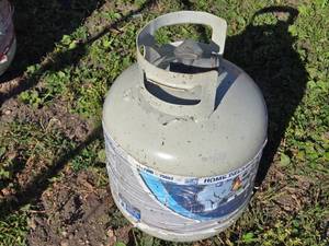 lot 44 image: Used Propane Tank - 20 lb Capacity with Visible Wear - Item is Off Site in SVEA See Desc