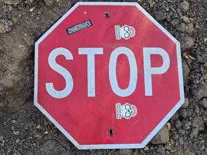lot 53 image: Used Octagonal STOP Sign - Reflective Surface with Minor Damage