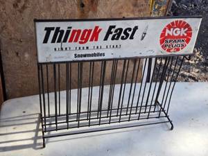lot 74 image: Vintage Metal Snowmobile Spark Plug Display Rack - Thingk Fast Advertising Sign