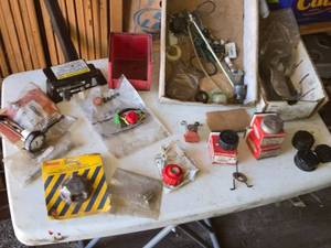lot 144 image: Assortment of Small Engine Parts and Fuel Caps
