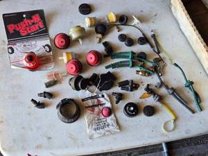 lot 145 image: Assortment of Small Engine Caps, Primer Bulbs and More
