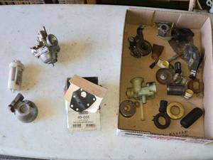lot 148 image: Assortment of Small Engine Carburetor Parts and Accessories