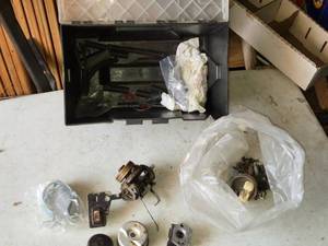 lot 156 image: Assortment of Used Small Engine Carburetor Parts and Storage Box