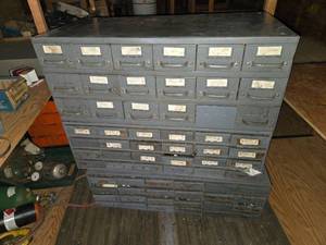 lot 259 image: Parts Cabinet Storage with Many Drawers Full of Plumbing Fittings -  Approximately 35 inches high, 34 inches wide, and 17 inches deep