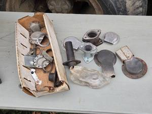 lot 273 image: Used Small Engine Muffler Guards and Other Parts