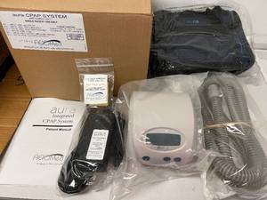 lot 11 image: MSRP $600 NEW IN BOX&nbspAeioMed 100529 Aura Small Portable Lightweight CPAP System with 2-Pack Filter Media, Power Supply, Hose, Carry Bag and Manual -&nbspan integrated, rechargeable battery, capable of powering the unit throughout the night