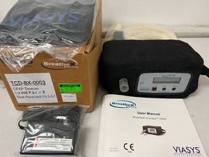 lot 1 image: NEW IN BOX TRAVEL BATTERY OPERATED COMPACT CPAP BUNDLE Viasys Healthcare Sleep Systems BreatheX Journey CPAP Machine with Power Supply, Hose, Carry Bag, and Manual -powered by a rechargeable battery that will provide 11 hours of use