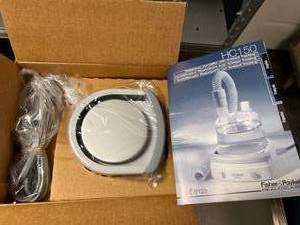 lot 15 image: MSRP $450 NEW IN BOX&nbspFisher & Paykel HC150 Heated Humidifier with Ambient Tracking -balances humidity to compensate for changes in room temperature, minimizing disruptive condensation -will work with any CPAPBIPAP On The Market