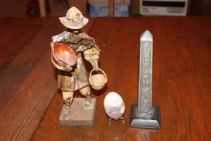 lot 195 image: Collection of 3 Decorative Figurines - Artisan Farmer, Egg, and Obelisk