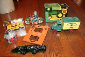 lot A-209 image: Collection of Vintage Toy Items - Including Tin Motorcycle, John Deere Tractor, and More