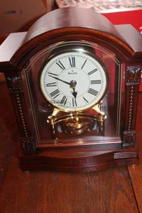 lot 260 image: Bulova Rhythms Collection Decorative Clock with Glass Case