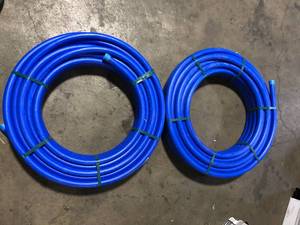 Lot of Advanced Drainage Systems 1 in. x 100 ft. CTS 250 PSI NSF Poly Pipe in Blue   Customer Returns See Pictures