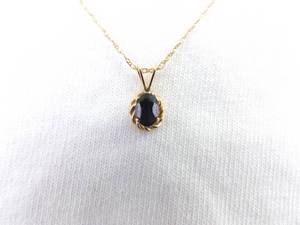 lot 113 image: 14K Yellow Gold Oval Cut Black Sapphire Pendant Necklace