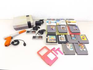 lot 12 image: Vintage Nintendo NES Gaming System wGames and Controllers