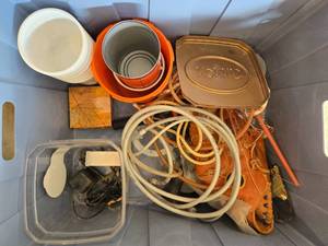 lot 105 image: Assorted Items in Storage Box - Includes Wilson Baseball Glove, Rope, Electrical Cords, Containers, and More