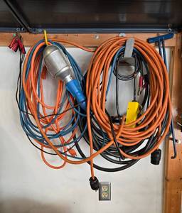 lot 115 image: Assortment of Electrical Extension Cords, Work Light, Jumper Cables and Power Tools Accessories
