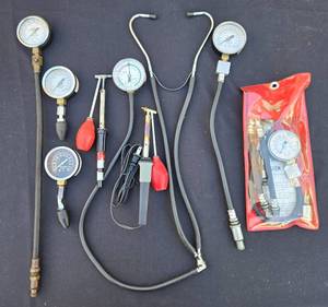 lot 559 image: Lot of 6 Automotive Compression Testers and Accessories - Various Gauges and Hoses