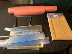 lot 279 image: Lot of Crafting Supplies - Unfinished Oak Cabinet Door, Assorted Plastic Sheets, and Craft Roll