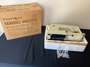 lot 386 image: Kenmore Sewing Machine Model No. 1211 with Assorted Bobbins - Unopened