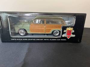 lot 394 image: 1949 Ford Woody Wagon Diecast Model - 118 Scale by Motor City Classics