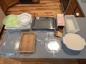 lot 472 image: Lot of Food Storage Containers, Pyrex Dishes, Woven Pan Holder, Cookie Cutters and More