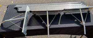 lot 35 image: Group of Steel Support Poles and Metal Mounting Plates