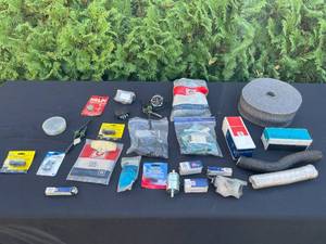 lot 162 image: PVC Plugs, Spark Plugs, Battery Terminals and Much More