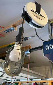 lot 604 image: Essex Handiwire 30 Ft. Retractable Reel Light - Hanging Garage Light