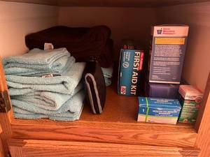 lot 491 image: Variety of Household Items - Assorted Towels, First Aid Kit, Neti Pot, and More