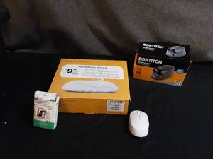 lot 22 image: Bostitch Pencil Sharpener, Watch Screen Cover, Mouse, & Home Phone Service.