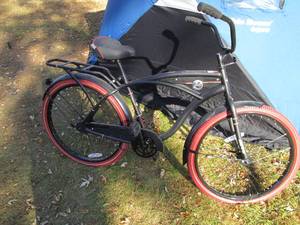 lot 10 image: Matte black Huffy Nel Lurro perfect...