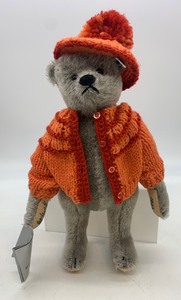 lot 99 image: Vintage STEIFF Mohair Teddy Bear with Knitted Orange Sweater and Hat, MIB