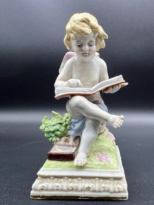 lot 139 image: SCHEIBE ALSBACH KISTER Figurine - Cherub Reading - Germany