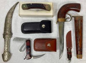 lot 153 image: Knife Collection - Uncle Henry Bear Paw, Sailor Knife, Mini Cub Hunter, Middle Eastern Dagger, and Vintage Decorative Wood Pistol with 7 Knife