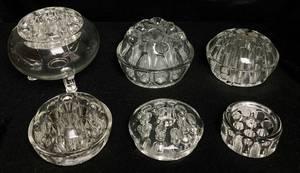lot 162 image: Uranium Glass Flower Frogs - 6 Pieces