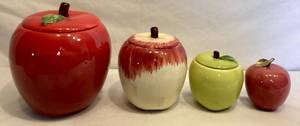 lot 63 image: Vintage Apple Collection - Red Apple Cookie Jar, Green Apple Candy Jar, Red Marble Apple and  RedCream Jar